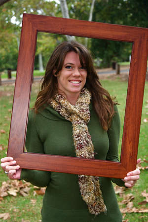 Young beautiful woman in an autumn setting