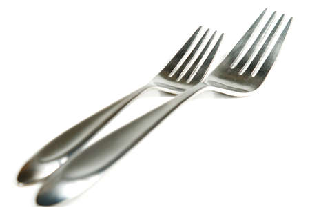 Modern silverware arranged in a place setting on a tableの写真素材