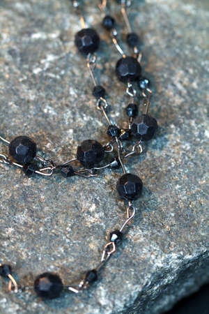 Vintage antique necklace closeup on a natural stone backgroundの写真素材