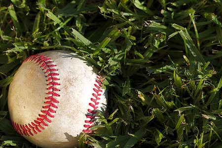 Close up macro view of the seams on a used baseballの写真素材