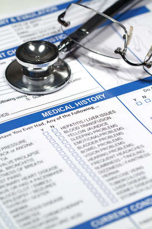 Close up of a Medical History form and a doctor's Stethoscope