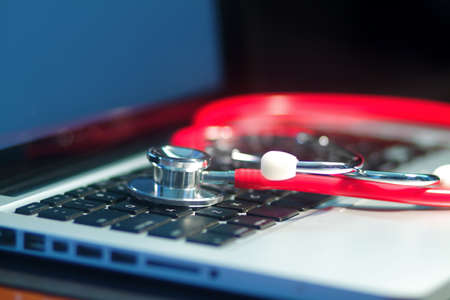A doctor's medical stethoscope in moody dark lightingの写真素材