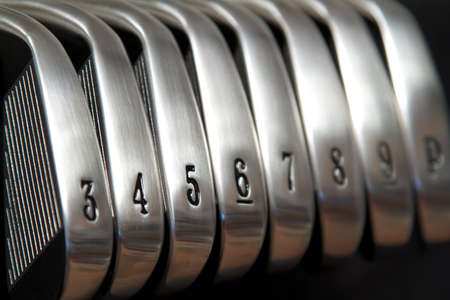 A brand new set of golf club ironsの写真素材