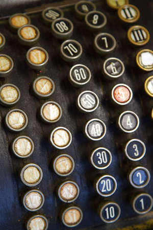 A close up of the old buttons on a Cash Register