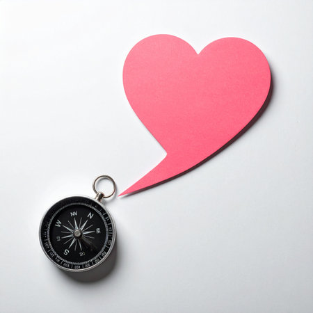 A compass on a clean white background receives guidance from a pink, heart-shaped speech bubble. This conceptual image represents following ones passion, making decisions with intuition, and letting love be the ultimate guide on lifes journey.の素材