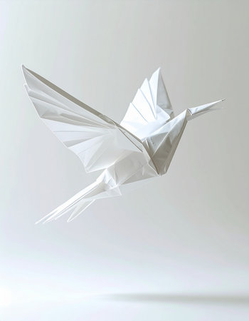 A single, elegant white origami bird is captured in mid-flight against a clean, minimalist background. Its delicate paper wings are spread, symbolizing freedom, peace, and the beauty of creative transformation. This image evokes a sense of hope and serene simplicity.の素材