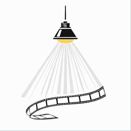 A single hanging lamp casts a spotlight, illuminating the magic of cinema captured on a classic film strip.のイラスト素材