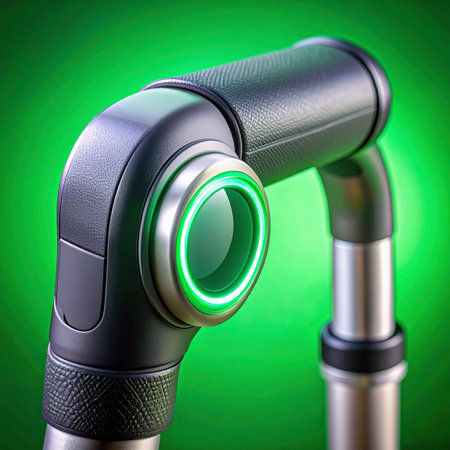 A close-up view of an advanced robotic joint, its central sensor glowing with a vibrant green light.の素材