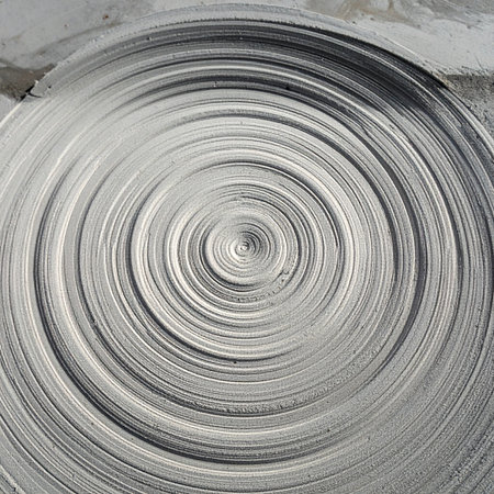 A mesmerizing vortex of brushed silver and gray tones creates a dynamic and hypnotic visual.の素材