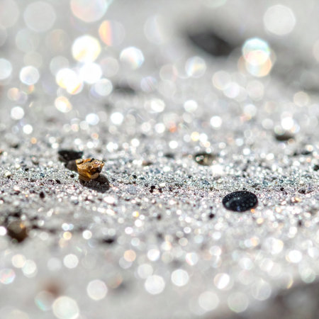 A dazzling macro view of silver glitter dust scattered across a surface, creating a magical and festive atmosphere.の素材