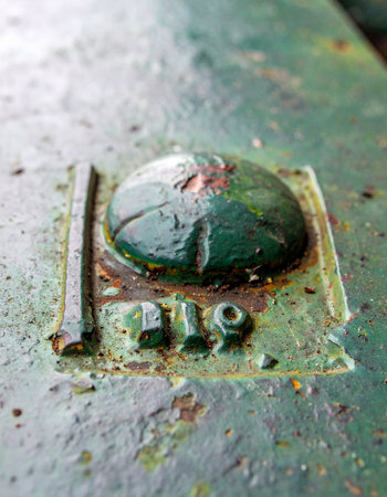 A close-up captures the weathered surface of a forgotten piece of industrial history.の素材