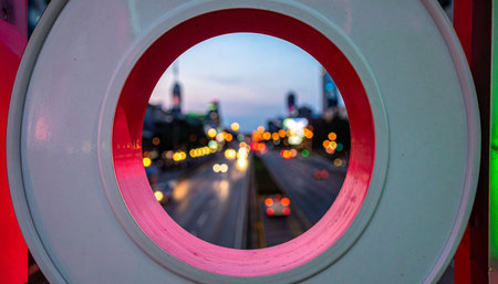 A dynamic city street at dusk, transformed into an abstract scene of light and motion.の素材