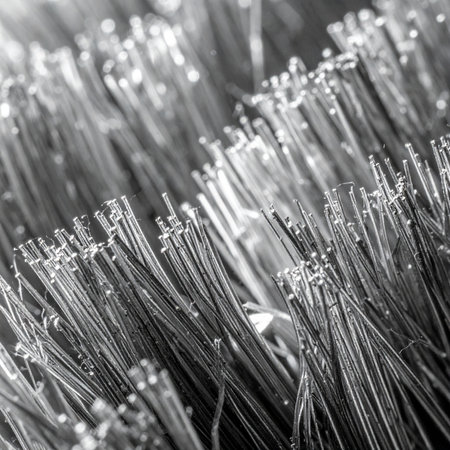 A detailed macro photograph captures the sharp, orderly yet complex world of industrial metal bristles.の素材