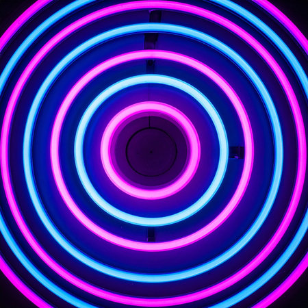 Step into a vibrant portal of light. Concentric rings of glowing blue and pink neon create a hypnotic tunnel, pulling the viewer into a futuristic and energetic dimension.の素材