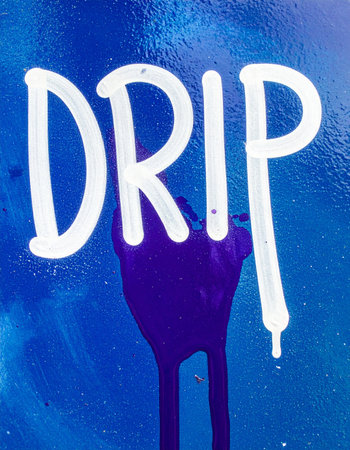 The word 'Drip' is scrawled in bold white letters against a vibrant blue, textured background.の素材