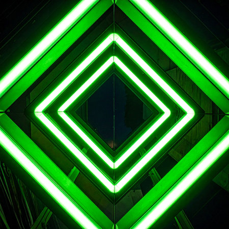 A mesmerizing view down an infinite corridor of glowing green neon squares.の素材