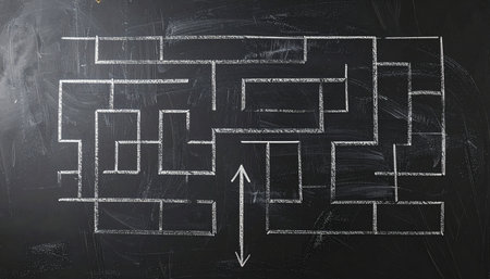 A complex maze drawn in white chalk on a dark blackboard. An arrow marks the entrance, symbolizing the start of a journey to find a solution.の素材