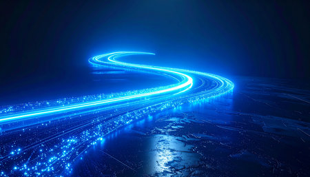 A vibrant stream of blue light carves a path through the darkness, representing the rapid flow of digital information.の素材