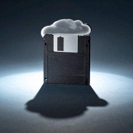 A single spotlight illuminates a relic of the past, a floppy disk, from which a modern cloud emerges.の素材