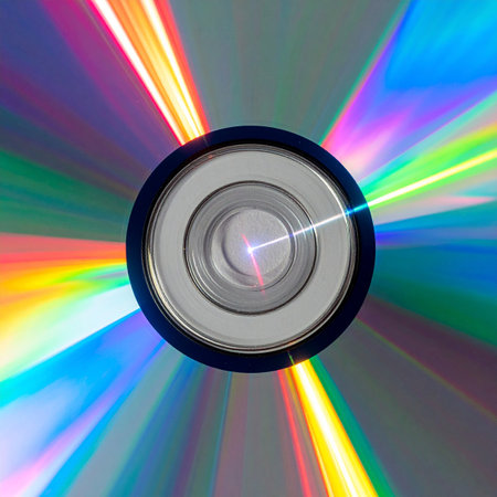 A macro view captures the mesmerizing diffraction of light on a compact disc's surface.の素材
