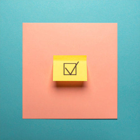A single checkmark on a bright sticky note signifies a task completed and a goal achieved.の素材