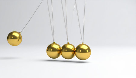 A single golden sphere is pulled back, poised to strike its neighbors in a classic Newton's Cradle.の素材