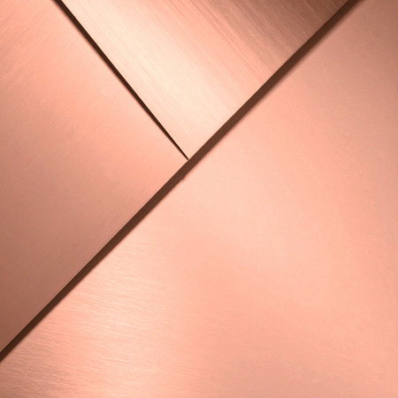 A precise arrangement of brushed copper sheets creates a dynamic geometric composition.の素材