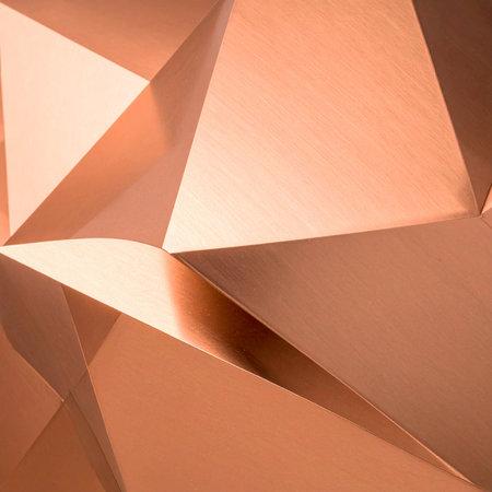 A close-up view of a complex, folded structure reveals a landscape of sharp angles and smooth planes.の素材