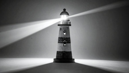 In the midst of darkness and uncertainty, a solitary lighthouse stands firm, casting powerful beams of light.の素材