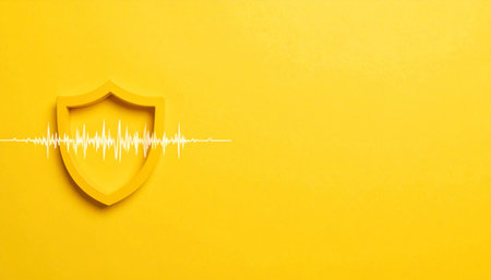 A vibrant yellow shield stands as a bastion of digital defense, deflecting a glowing energy wave that represents a cyber threat.の素材