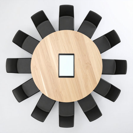 An aerial view of a modern, circular conference table set for a pivotal meeting.の素材