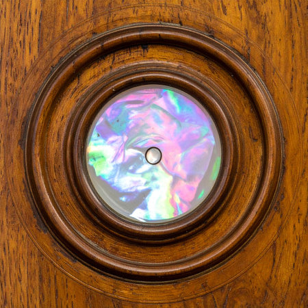 A macro detail shot of an exquisite mother-of-pearl inlay.の素材