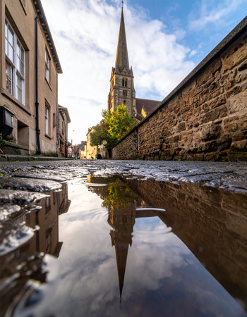 After a brief shower, the ancient cobblestone streets of a historic European town gleam.の素材