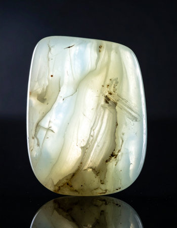 A beautifully polished agate cabochon reveals its intricate inner world.の素材
