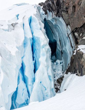 A stunning close-up reveals the ancient, compressed heart of a mountain glacier.の素材