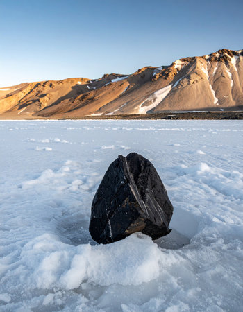 Black rock on the snow in Iceland, Svalbard, Norwayの素材