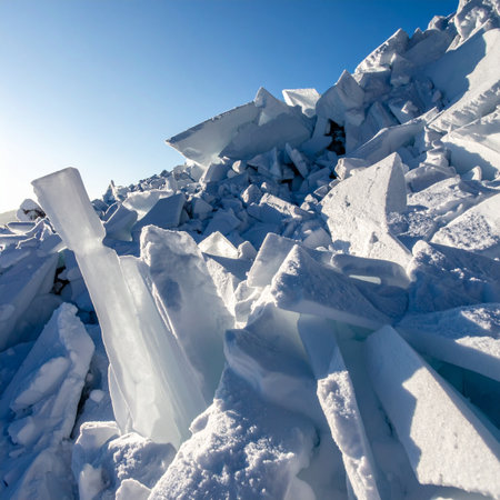 The early morning sun casts long shadows across a chaotic landscape of fractured glacial ice.の素材