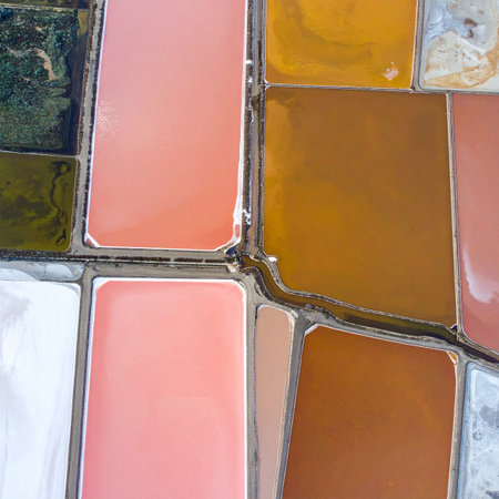 An abstract aerial perspective captures the stunning, otherworldly beauty of salt evaporation ponds.の素材