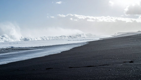 Experience the raw power of the ocean as immense white waves crash against a stark, volcanic black sand beach. This dramatic coastal landscape captures the untamed beauty and powerful forces of nature in a remote, breathtaking setting.の素材