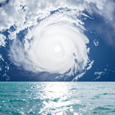 From just above the turbulent sea, the immense and terrifying beauty of a hurricane unfolds. The powerful vortex of clouds swirls with unstoppable force, a dramatic display of natures raw power. This epic weather event serves as a stark reminder of climate change and the overwhelming forces that shape our planet.の素材