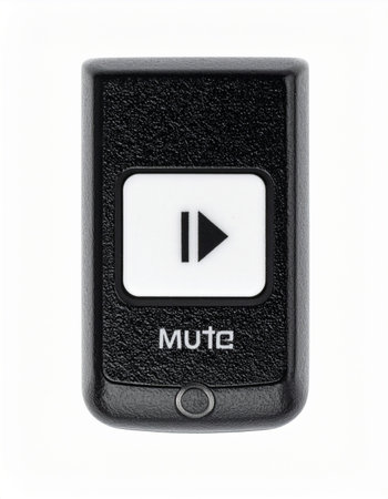 A sleek, black media remote control is shown in a close-up studio shot, isolated against a clean white background.の素材