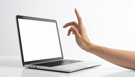 A user's hand gracefully swipes through a virtual interface on a modern laptop, demonstrating the future of intuitive technology and seamless digital interaction.の素材