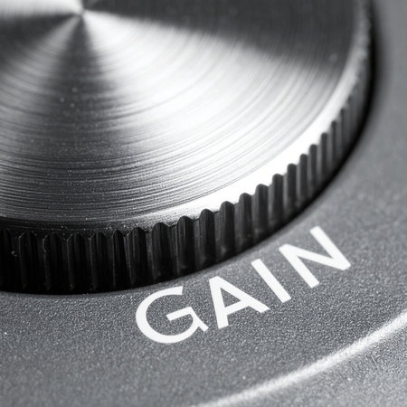 A macro shot captures the precise detail of a metallic gain knob.の素材