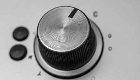 A detailed macro shot of a brushed metal control knob in black and white.の素材