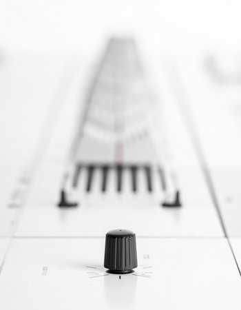 In a clean, minimalist studio, a single control knob stands in sharp focus, representing the critical point of adjustment.の素材