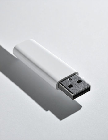 In a world of digital information, this sleek white USB drive stands as a symbol of security and simplicity.の素材