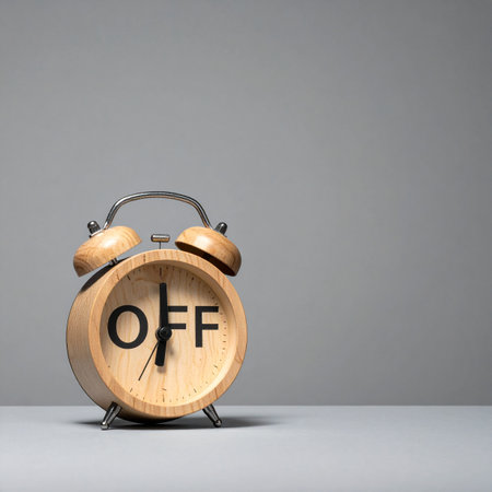 A wooden alarm clock with the word 'OFF' on its face, symbolizing the importance of taking a break.の素材