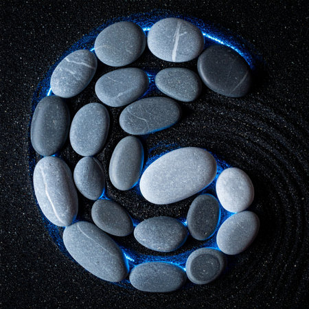 Smooth river stones form the ancient symbol of yin and yang, representing the harmony of opposites.の素材