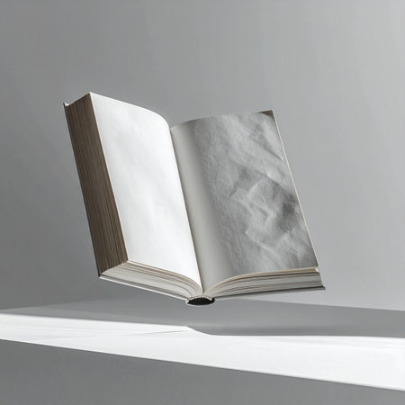 An open book defies gravity, floating in a stark, minimalist space.の素材