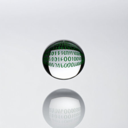 A crystal clear orb levitates in a clean, white space, encapsulating the complex world of binary code.の素材